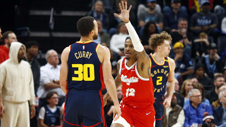 Dec 19, 2024; Memphis, Tennessee, USA; Memphis Grizzlies guard Ja Morant (12) reacts after a missed shot attempt by Golden State Warriors guard Stephen Curry (30) during the second quarter at FedExForum. Mandatory Credit: Petre Thomas-Imagn Images Dec 19, 2024; Memphis, Tennessee, USA; Memphis Grizzlies guard Ja Morant (12) reacts after a missed shot attempt by Golden State Warriors guard Stephen Curry (30) during the second quarter at FedExForum. Mandatory Credit: Petre Thomas-Imagn Images