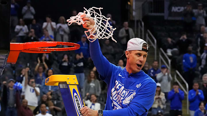 Mar 29, 2025; Newark, NJ, USA; Duke Blue Devils head coach Jon Scheyer cuts down the net after the Duke Blue Devils beat the Alabama Crimson Tide in the East Regional final of the 2025 NCAA tournament at Prudential Center. Mandatory Credit: Robert Deutsch-Imagn Images Mar 29, 2025; Newark, NJ, USA; Duke Blue Devils head coach Jon Scheyer cuts down the net after the Duke Blue Devils beat the Alabama Crimson Tide in the East Regional final of the 2025 NCAA tournament at Prudential Center. Mandatory Credit: Robert Deutsch-Imagn Images