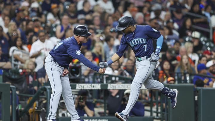 Seattle Mariners second baseman Jorge Polanco (7) celebrates with third base coach Manny Acta (14) after hitting a home run during the third inning against the Houston Astros at Minute Maid Park on May 3. Seattle Mariners second baseman Jorge Polanco (7) celebrates with third base coach Manny Acta (14) after hitting a home run during the third inning against the Houston Astros at Minute Maid Park on May 3.