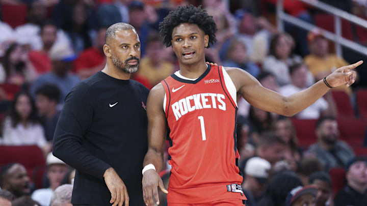 Oct 25, 2024; Houston, Texas, USA; Houston Rockets head coach Ime Udoka talks with forward Amen Thompson (1) during the third quarter against the Memphis Grizzlies at Toyota Center. Mandatory Credit: Troy Taormina-Imagn Images