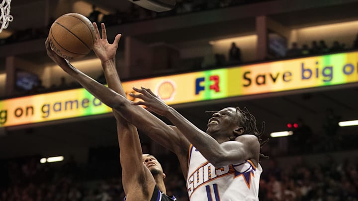 November 13, 2024; Sacramento, California, USA; Phoenix Suns center Bol Bol (11) shoots the basketball against Sacramento Kings forward Keegan Murray (13) during the fourth quarter at Golden 1 Center. Mandatory Credit: Kyle Terada-Imagn Images