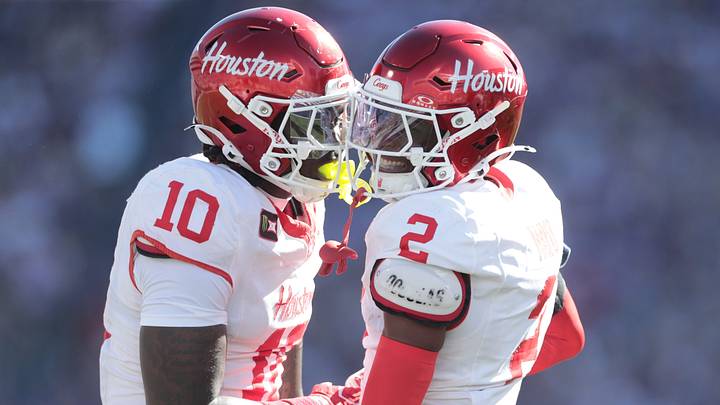 Houston CB Jalen Mayo celebrates with LB Latreveon McCutchin after a play against Kansas State. Houston CB Jalen Mayo celebrates with LB Latreveon McCutchin after a play against Kansas State.