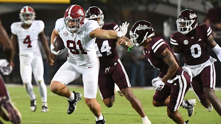Sep 30, 2023; Starkville, Mississippi, USA; Alabama Crimson Tide tight end CJ Dippre (81) runs after making a catch and uses a stiff arm on Mississippi State Bulldogs safety Marcus Banks (1) in Davis Wade Stadium at Mississippi State University. Alabama defeated Mississippi State 40-17. Mandatory Credit: Gary Cosby Jr.-Tuscaloosa News