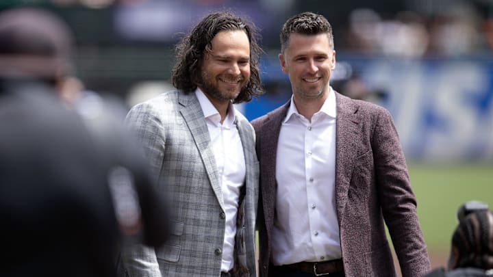 Apr 26, 2025; San Francisco, California, USA; Former San Francisco Giants shortstop Brandon Crawford (left) poses for a photograph Giants president of baseball operations Buster Posey following a ceremony to honor his legacy with the team before a game against the Texas Rangers at Oracle Park. Mandatory Credit: D. Ross Cameron-Imagn Images