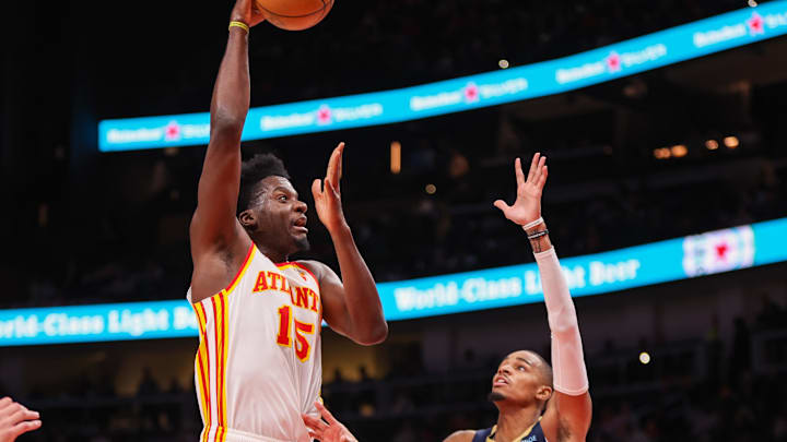 Dec 2, 2024; Atlanta, Georgia, USA; Atlanta Hawks center Clint Capela (15) shoots over New Orleans Pelicans guard Dejounte Murray (5) in the second quarter at State Farm Arena. Mandatory Credit: Brett Davis-Imagn Images