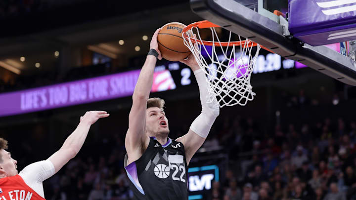Mar 14, 2025; Salt Lake City, Utah, USA;  Utah Jazz forward Kyle Filipowski (22) attempts to dunk the ball during the first quarter against the Toronto Raptors at Delta Center. Mandatory Credit: Chris Nicoll-Imagn Images