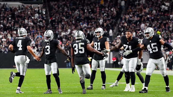 Dec 14, 2023; Paradise, Nevada, USA; The Las Vegas Raiders celebrate after a touchdown by tight end