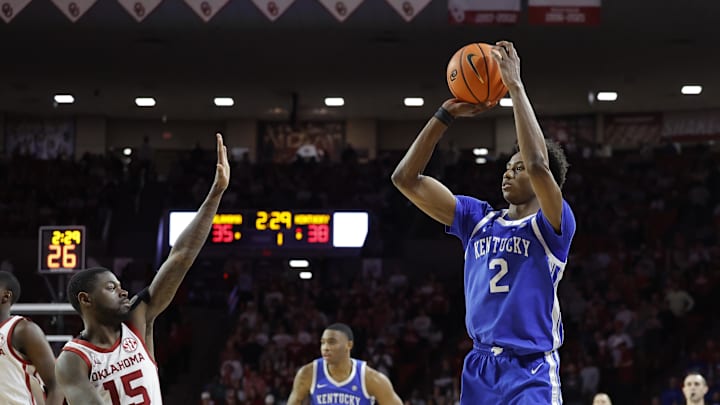 Feb 26, 2025; Norman, Oklahoma, USA; Kentucky Wildcats guard Jaxson Robinson (2) shoots a three point basket as Oklahoma Sooners guard Duke Miles (15) defend during the first half at Lloyd Noble Center. Mandatory Credit: Alonzo Adams-Imagn Images