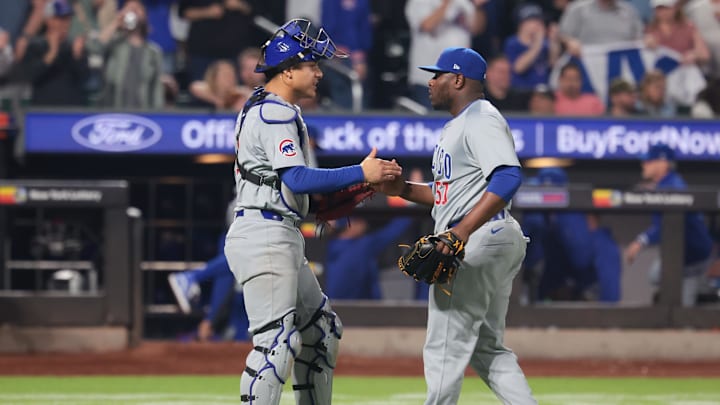 Apr 29, 2024; New York City, New York, USA; Chicago Cubs relief pitcher Hector Neris (51) celebrates with catcher Miguel Amaya (9) after closing the game against the New York Mets at Citi Field. Mandatory Credit: Vincent Carchietta-Imagn Images
