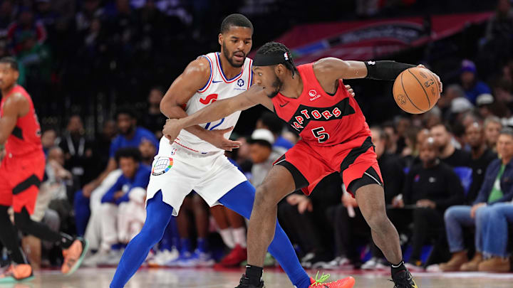 Feb 11, 2025; Philadelphia, Pennsylvania, USA; Toronto Raptors guard Immanuel Quickley (5) controls the ball against Philadelphia 76ers guard Jared Butler (12) in the second quarter at Wells Fargo Center. Mandatory Credit: Kyle Ross-Imagn Images Feb 11, 2025; Philadelphia, Pennsylvania, USA; Toronto Raptors guard Immanuel Quickley (5) controls the ball against Philadelphia 76ers guard Jared Butler (12) in the second quarter at Wells Fargo Center. Mandatory Credit: Kyle Ross-Imagn Images