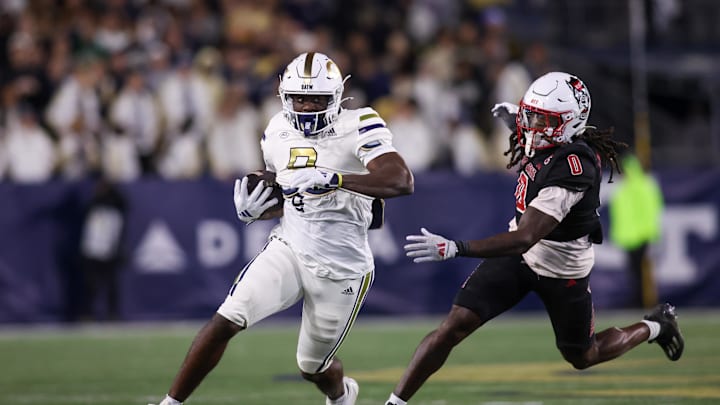 Nov 21, 2024; Atlanta, Georgia, USA; Georgia Tech Yellow Jackets wide receiver Avery Boyd (9) runs past North Carolina State Wolfpack linebacker Sean Brown (0) in the second quarter at Bobby Dodd Stadium at Hyundai Field. Mandatory Credit: Brett Davis-Imagn Images