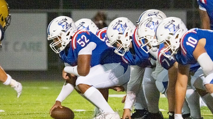 Churchill offensive lineman Xander Mafoti snaps the ball as the Churchill Lancers host the Marist Catholic Spartans on Aug. 29, 2025, at Churchill High School in Eugene, Oregon.