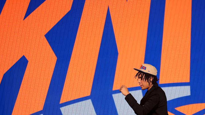 Jun 26, 2024; Brooklyn, NY, USA; Pacome Dadiet walks off stage after being selected twenty-fifth overall by the New York Knicks in the first round of the 2024 NBA Draft at Barclays Center. Mandatory Credit: Brad Penner-Imagn Images