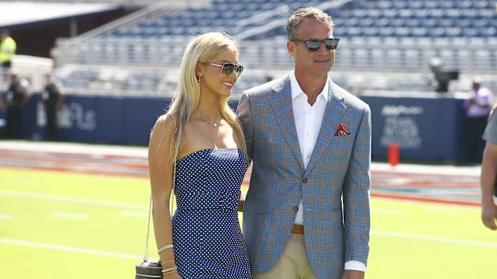 Mississippi Rebels head coach Lane Kiffin poses for a photo with his daughter Landry Kiffin prior to the game against the LSU Tigers at Vaught-Hemingway Stadium.