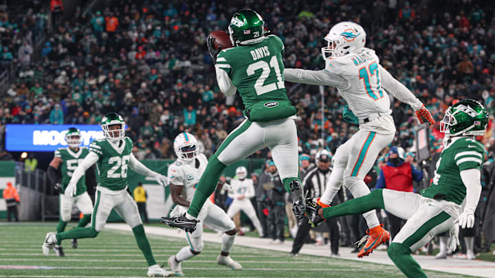 New York Jets safety Ashtyn Davis (21) intercepts a pass intended for Miami Dolphins wide receiver Jaylen Waddle (17) during the first half at MetLife Stadium.