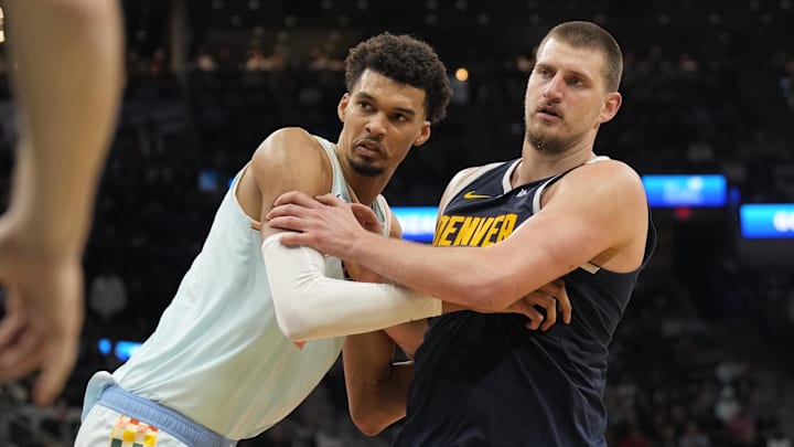 San Antonio Spurs center Victor Wembanyama (1) and Denver Nuggets center Nikola Jokic (15) battle for position during an inbound pass in the second half at Frost Bank Center. Mandatory Credit: Scott Wachter-Imagn Images