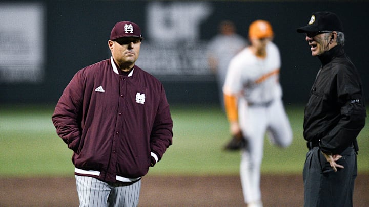 Mississippi State baseball coach Chris Lemonis talks with an official during the NCAA baseball game