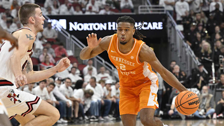 Nov 9, 2024; Louisville, Kentucky, USA;  Tennessee Volunteers guard Chaz Lanier (2) dribbles against Louisville Cardinals forward Noah Waterman (93) during the first half at KFC Yum! Center. Tennessee defeated Louisville 77-55. Mandatory Credit: Jamie Rhodes-Imagn Images