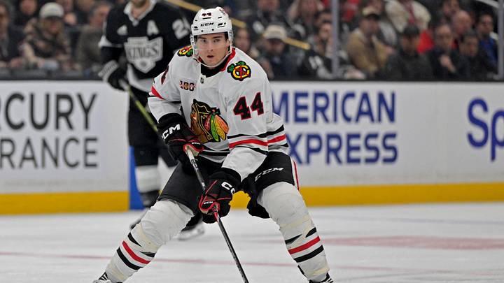 Dec 4, 2025; Los Angeles, California, USA;  Chicago Blackhawks defenseman Wyatt Kaiser (44) handles the puck against the Los Angeles Kings at Crypto.com Arena. Mandatory Credit: Jayne Kamin-Oncea-Imagn Images