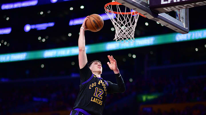 Apr 10, 2026; Los Angeles, California, USA; Los Angeles Lakers forward Jake LaRavia (12) scores a basket against the Phoenix Suns during the second half at Crypto.com Arena. Mandatory Credit: Gary A. Vasquez-Imagn Images