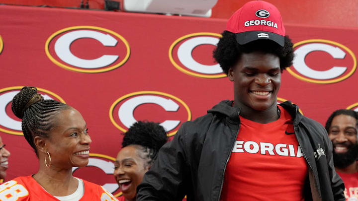 Anthony “AJ” Lonon’s mother Deborah reacts after he announced his decision to play for the University of Georgia over Georgia Tech during a commitment decision ceremony at Clarke Central in Athens, Georgia, on Saturday, August 2, 2025. Lonon chose the University of Georgia.