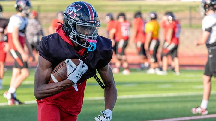 Junior safety Gabriel Osborne Jr. participates in a drill during football practice at Mustang High School in Mustang, Okla., on Friday, Aug. 15, 2025.