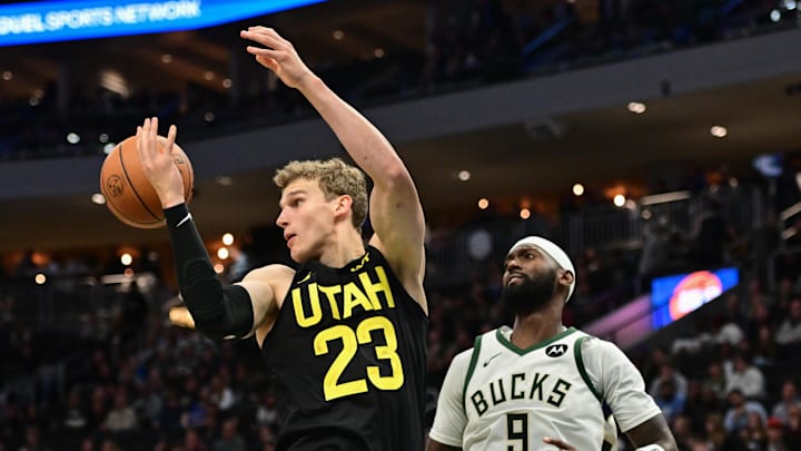 Nov 7, 2024; Milwaukee, Wisconsin, USA; Utah Jazz forward Lauri Markkanen (23) reaches for a rebound against Milwaukee Bucks forward Bobby Portis (9) in the third quarter at Fiserv Forum. Mandatory Credit: Benny Sieu-Imagn Images Nov 7, 2024; Milwaukee, Wisconsin, USA; Utah Jazz forward Lauri Markkanen (23) reaches for a rebound against Milwaukee Bucks forward Bobby Portis (9) in the third quarter at Fiserv Forum. Mandatory Credit: Benny Sieu-Imagn Images