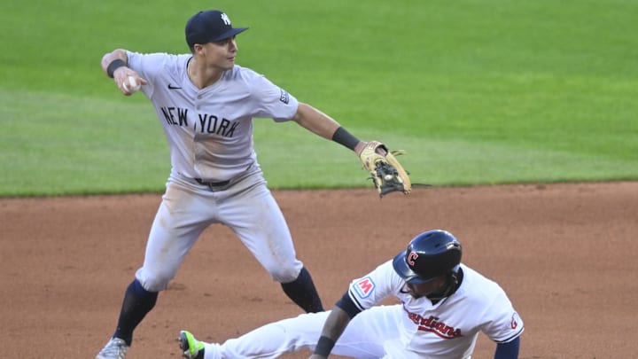 Apr 13, 2024; Cleveland, Ohio, USA; New York Yankees shortstop Anthony Volpe (11) turns a double