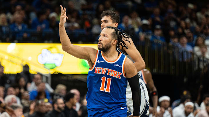 Dec 15, 2024; Orlando, Florida, USA; New York Knicks guard Jalen Brunson (11) celebrates a three pointer against the Orlando Magic in the fourth quarter at Kia Center. Mandatory Credit: Jeremy Reper-Imagn Images
