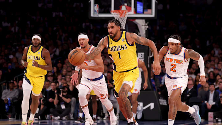 Indiana Pacers forward Obi Toppin brings the ball up court against New York Knicks guards Josh Hart and Miles McBride. Mandatory Credit: Brad Penner-Imagn Images