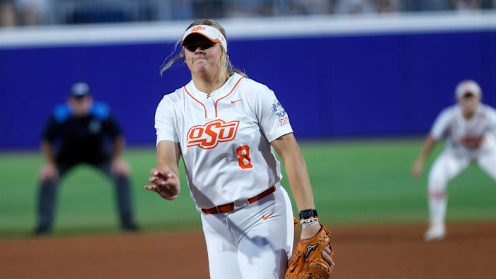 Oklahoma State's Lexi Kilfoyl (8) throws a pitch during the Women's College World Series game between the Oklahoma State Cowgirls and Stanford at Devon Park in Oklahoma City, Friday, May, 31, 2024.