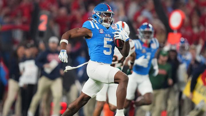 Ole Miss Rebels running back Kewan Lacy (5) scores on a 73-yard touchdown run against the Miami Hurricanes during their Vrbo Fiesta Bowl matchup at State Farm Stadium on Jan. 8, 2026.
