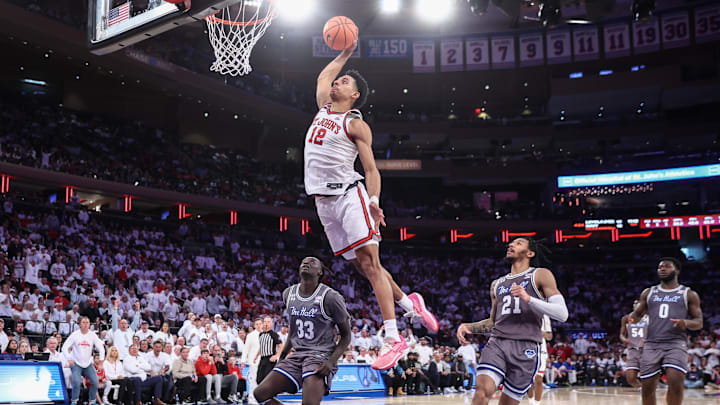 Mar 1, 2025; New York, New York, USA;  St. John's basketball guard RJ Luis Jr. (12) goes up for a dunk in the second half against the Seton Hall Pirates at Madison Square Garden.