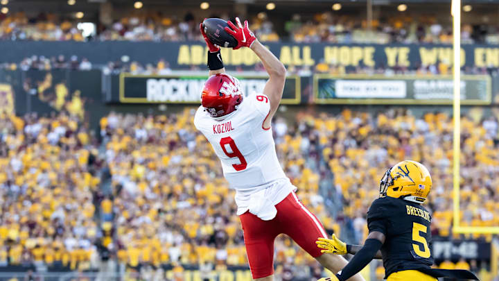 Oct 25, 2025; Tempe, Arizona, USA; Houston Cougars tight end Tanner Koziol (9) catches a pass against Arizona State Sun Devils safety Kyndrich Breedlove (5) in the first half at Mountain America Stadium. Mandatory Credit: Mark J. Rebilas-Imagn Images Oct 25, 2025; Tempe, Arizona, USA; Houston Cougars tight end Tanner Koziol (9) catches a pass against Arizona State Sun Devils safety Kyndrich Breedlove (5) in the first half at Mountain America Stadium. Mandatory Credit: Mark J. Rebilas-Imagn Images