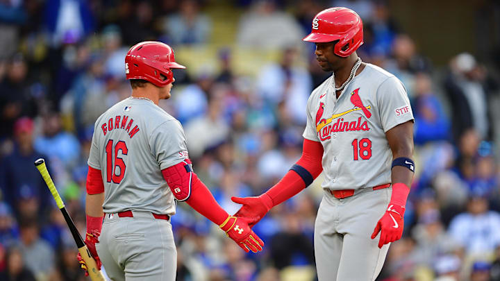 Mar 31, 2024; Los Angeles, California, USA; St. Louis Cardinals right fielder Jordan Walker (18) is greeted by second baseman Nolan Gorman (16) after scoring a run with bases loaded against the Los Angeles Dodgers during the sixth inning at Dodger Stadium. Mandatory Credit: Gary A. Vasquez-Imagn Images