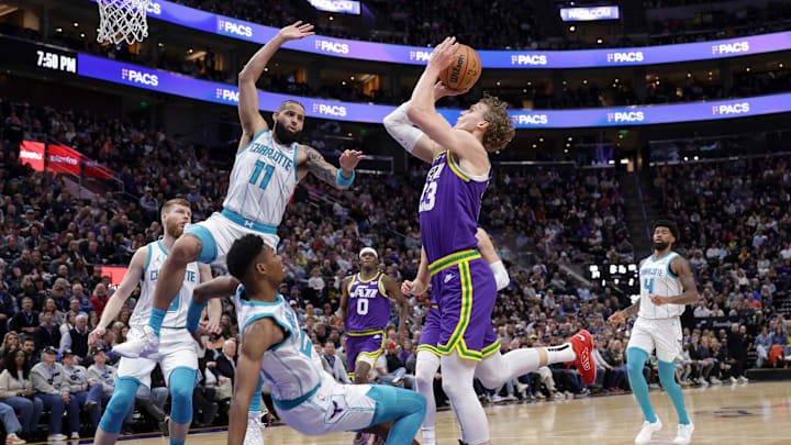 Feb 22, 2024; Salt Lake City, Utah, USA;  Utah Jazz forward Lauri Markkanen (23) runs into Charlotte Hornets forward Brandon Miller (24) while trying to shoot the ball during the second quarter at Delta Center. Mandatory Credit: Chris Nicoll-Imagn Images