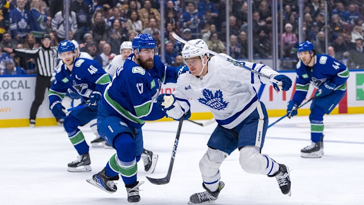 Feb 8, 2025; Vancouver, British Columbia, CAN; Toronto Maple Leafs forward William Nylander (88) drives past Vancouver Canucks defenseman Filip Hronek (17) in the third period at Rogers Arena. Mandatory Credit: Bob Frid-Imagn Images