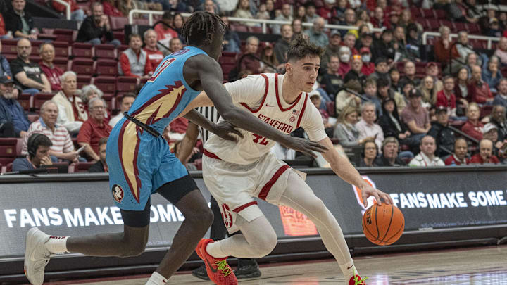 Jan 25, 2025; Stanford, California, USA; Stanford Cardinal forward Maxime Raynaud (42) drives the ball during the first half against Florida State Seminoles forward Taylor Bol Bowen (10) at Maples Pavilion. Mandatory Credit: Stan Szeto-Imagn Images Jan 25, 2025; Stanford, California, USA; Stanford Cardinal forward Maxime Raynaud (42) drives the ball during the first half against Florida State Seminoles forward Taylor Bol Bowen (10) at Maples Pavilion. Mandatory Credit: Stan Szeto-Imagn Images