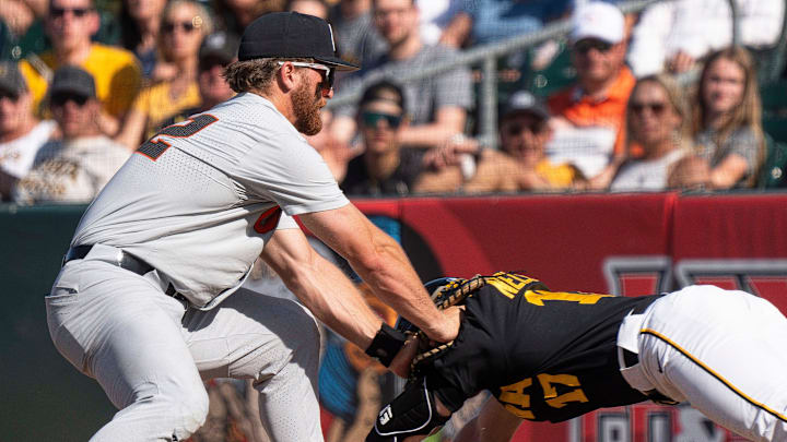 Oregon State's Jacob Krieg tags Iowa's Andy Nelson at first base during game 2 of Iowa vs. Oregon State baseball at Principal Park on May 10, 2025, in Des Moines.