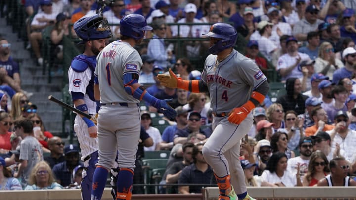 Jun 22, 2024; Chicago, Illinois, USA; New York Mets catcher Francisco Alvarez (4) is greeted by second baseman Jeff McNeil (1) after hitting a home run against the Chicago Cubs during the fifth inning at Wrigley Field. Jun 22, 2024; Chicago, Illinois, USA; New York Mets catcher Francisco Alvarez (4) is greeted by second baseman Jeff McNeil (1) after hitting a home run against the Chicago Cubs during the fifth inning at Wrigley Field.