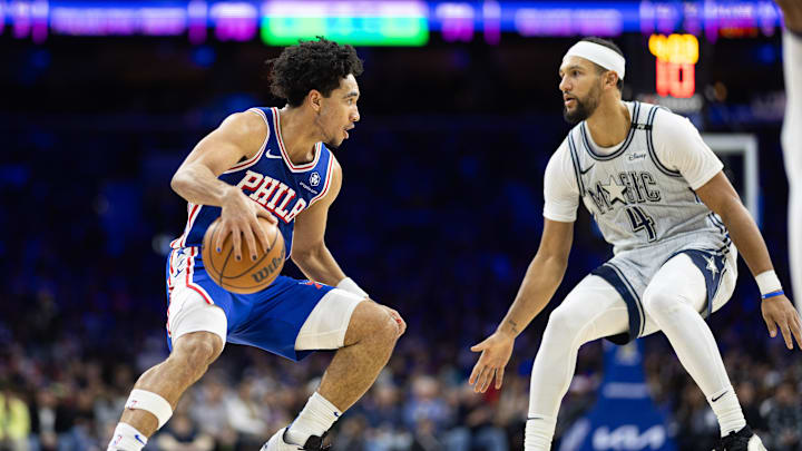Dec 4, 2024; Philadelphia, Pennsylvania, USA; Philadelphia 76ers guard Jared McCain (20) dribbles the ball against Orlando Magic guard Jalen Suggs (4) during the third quarter at Wells Fargo Center. Mandatory Credit: Bill Streicher-Imagn Images