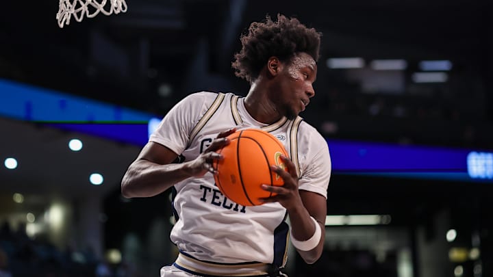 Feb 11, 2026; Atlanta, Georgia, USA; Georgia Tech Yellow Jackets forward Baye Ndongo (11) grabs a rebound against the Wake Forest Demon Deacons in the first quarter at McCamish Pavilion. Mandatory Credit: Brett Davis-Imagn Images