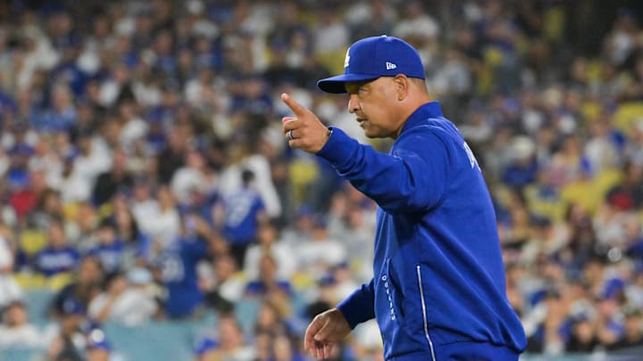 Sep 30, 2025; Los Angeles, California, USA; Los Angeles Dodgers manager Dave Roberts (30) makes a pitching change during the eighth inning against the Cincinnati Reds during game one of the Wildcard round for the 2025 MLB playoffs at Dodger Stadium. Mandatory Credit: Jayne Kamin-Oncea-Imagn Images Sep 30, 2025; Los Angeles, California, USA; Los Angeles Dodgers manager Dave Roberts (30) makes a pitching change during the eighth inning against the Cincinnati Reds during game one of the Wildcard round for the 2025 MLB playoffs at Dodger Stadium. Mandatory Credit: Jayne Kamin-Oncea-Imagn Images
