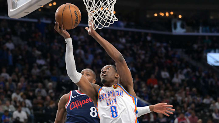 Apr 8, 2026; Inglewood, California, USA; Los Angeles Clippers guard Kris Dunn (8) defends Oklahoma City Thunder guard Jalen Williams (8) as he drives to the basket in the second half at Intuit Dome. Mandatory Credit: Jayne Kamin-Oncea-Imagn Images