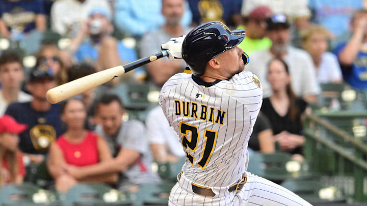 Sep 14, 2025; Milwaukee, Wisconsin, USA; Milwaukee Brewers third baseman Caleb Durbin (21) hits a solo home run against the St. Louis Cardinals in the fourth inning at American Family Field. Mandatory Credit: Benny Sieu-Imagn Images