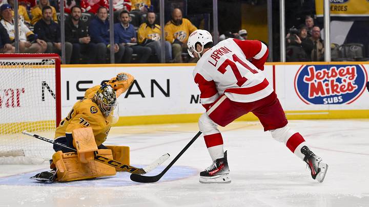 Mar 2, 2026; Nashville, Tennessee, USA; Nashville Predators goaltender Juuse Saros (74) blocks the shot of Detroit Red Wings center Dylan Larkin (71) during the third period at Bridgestone Arena. Mandatory Credit: Steve Roberts-Imagn Images Mar 2, 2026; Nashville, Tennessee, USA; Nashville Predators goaltender Juuse Saros (74) blocks the shot of Detroit Red Wings center Dylan Larkin (71) during the third period at Bridgestone Arena. Mandatory Credit: Steve Roberts-Imagn Images