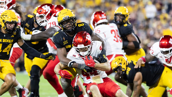 Oct 25, 2025; Tempe, Arizona, USA; Houston Cougars running back Dean Connors (44) is tackled by Arizona State Sun Devils linebacker Jordan Crook (8) in the first half at Mountain America Stadium. Mandatory Credit: Mark J. Rebilas-Imagn Images Oct 25, 2025; Tempe, Arizona, USA; Houston Cougars running back Dean Connors (44) is tackled by Arizona State Sun Devils linebacker Jordan Crook (8) in the first half at Mountain America Stadium. Mandatory Credit: Mark J. Rebilas-Imagn Images