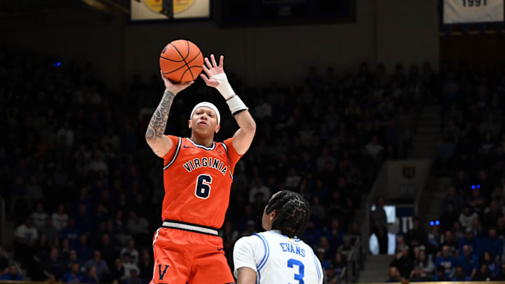 Feb 28, 2026; Durham, North Carolina, USA; Virginia Cavaliers guard Jacari White (6) shoots over Duke Blue Devils forward Isaiah Evans (3) during the first half at Cameron Indoor Stadium. Mandatory Credit: Rob Kinnan-Imagn Images