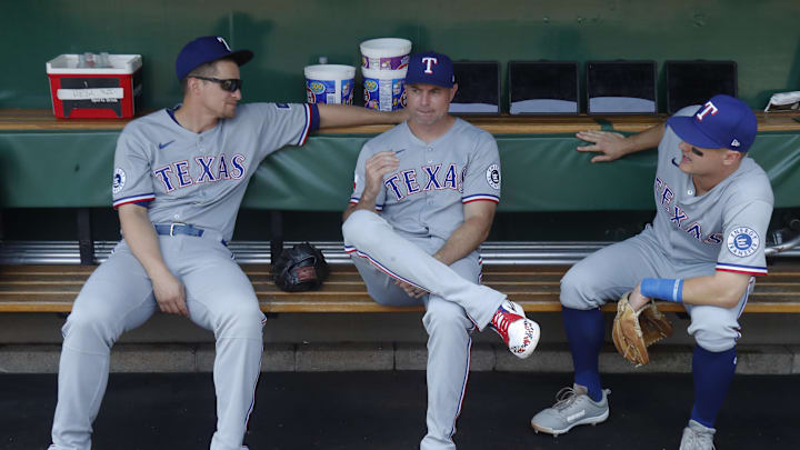 Jun 22, 2025; Pittsburgh, Pennsylvania, USA;  Texas Rangers shortstop Corey Seager (left) and first base coach Corey Ragsdale (middle) and third baseman Josh Jung (6) talk in the dugout before the game against the Pittsburgh Pirates at PNC Park. 