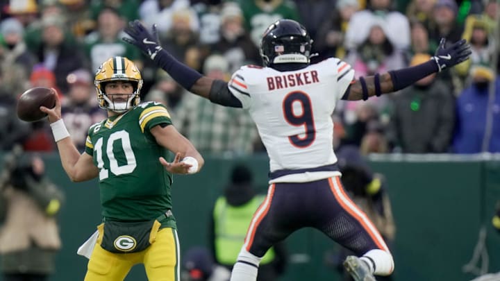 Green Bay Packers quarterback Jordan Love (10) throws a pass while pressured by Chicago Bears safety Jaquan Brisker (9) during the first quarter of their game Sunday, December 7, 2025 at Lambeau Field in Green Bay, Wisconsin.